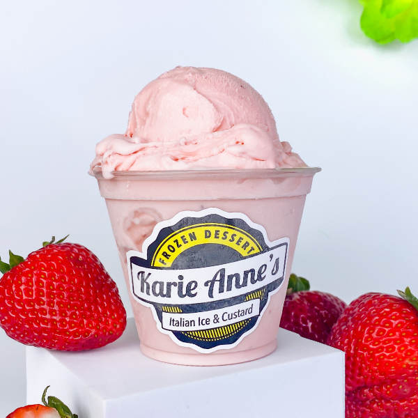 a pink-colored custard with strawberries in the background